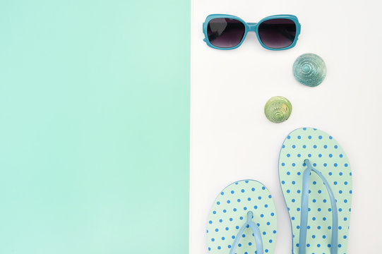 Modern fashionable sunglasses and sandals with starfish for background