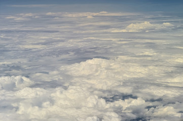 The top view on clouds from an airplane window