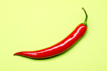 chili on a green pastel background