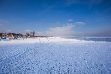 snow covered beach and sea