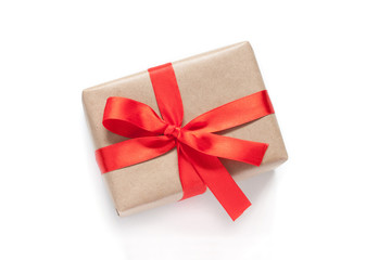Gift box tied with red ribbon and bow. Festive packaging mockup