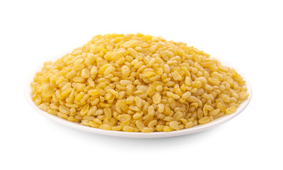 Hulled-split monk bean in wooden spoon isolated on white background