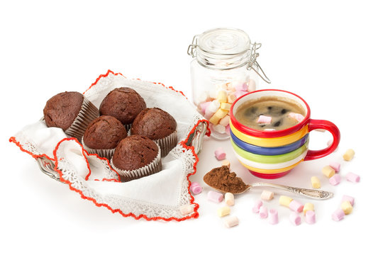 Cup of hot chocolate with marshmallow and chocolate muffins .