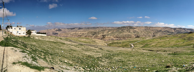 Fototapeta na wymiar Composite high-resolution panoramic view from the plateau off the Dana Reserve Dana Reserve, an over 1000-metre deep valley cut in the south-western mountainous region of the Kingdom of Jordan.