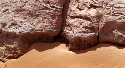 Rock and fine sand with ripple marks and wind ripples in the desert of Wadi Rum, Jordan