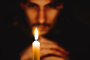 a monk with a candle