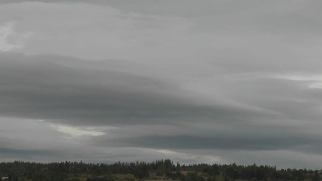 Dark rain clouds race across the sky near Talca, Chile.