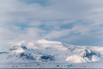 Dramatic icelandic landscape with snow covered mountains. Cold winter day in Iceland.