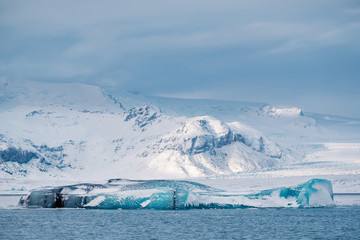 Fototapeta na wymiar Winter landscape view of popular Glacier Lagoon with many small icebergs - Jokulsarlon, east Iceland.