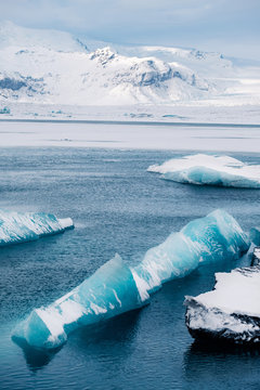 Winter landscape view of popular Glacier Lagoon with many small icebergs - Jokulsarlon, east Iceland.