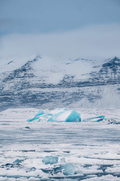 Winter landscape view of popular Glacier Lagoon with many small icebergs - Jokulsarlon, east Iceland.