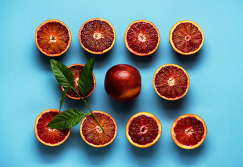 Fruits Red Oranges Pattern Background. Citrus on a blue background