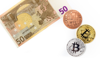 Image of bitcoins on euro bill