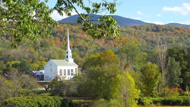 The church and steeple at Stowe Vermont perfectly captures small town America or New England beauty.
