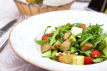 Fresh green salad with pears, feta cheese and avocado