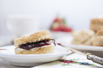 Close-up Scones with butter and strawberry jam