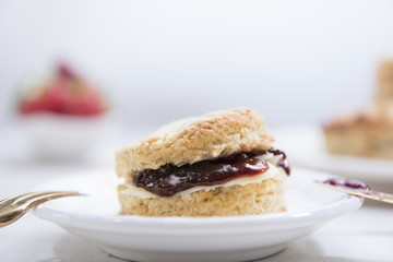 Close-up Scones with butter and strawberry jam