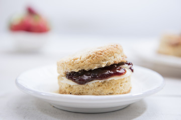 Close-up Scones with butter and strawberry jam