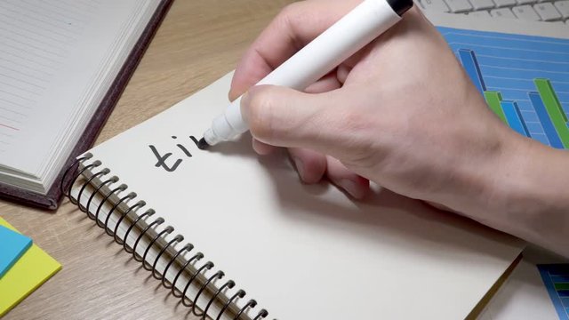 Man writing time to start at note. Motivation for changes.