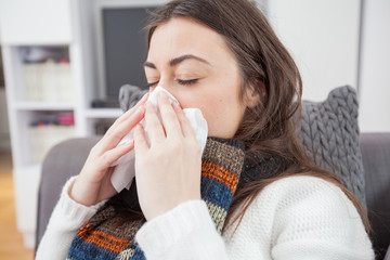 Young ill woman at home