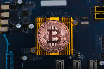 Bitcoin digital currency,  bit-coin on motherboard or electronic board with chips, Cryptocurrency money concept