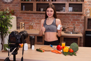 You are what you eat! Young charming sportswoman being in the ki