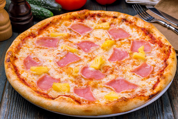 pizza Hawaiian with pineapple and ham