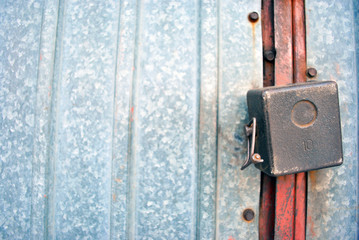 Iron door and with hanging padlock, private territory zone border, horizontal background