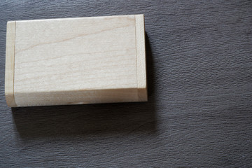 Usb flash drive with wooden surface in wooden box on desk for USB port plug-in computer laptop for transfer data and backup business concept