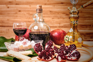 Still-life with Hookah, wine, garnet and sweets