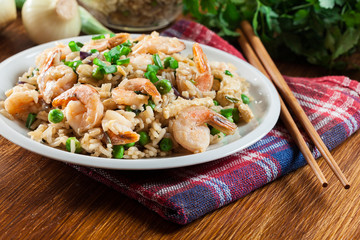 Fried rice with shrimp and vegetables served on a plate