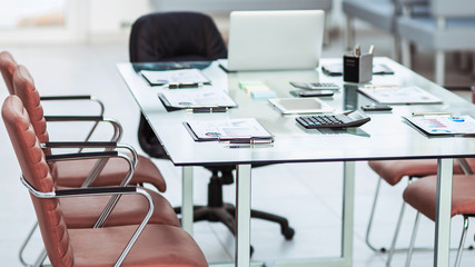 financial charts,calculators,notebook and pens laid out on the desktop before starting business negotiations