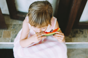 Adorable Little Girl Eating Watermelon