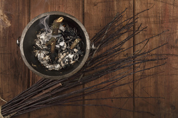 Obraz na płótnie Canvas Overhead photo of smoking witch's cauldron with broom and copy space