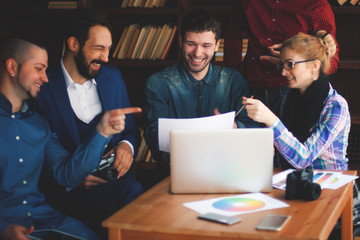 team of copywriters discussing a new advertising project