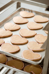 close-up shot of tasty cookies in shape of heart on tray