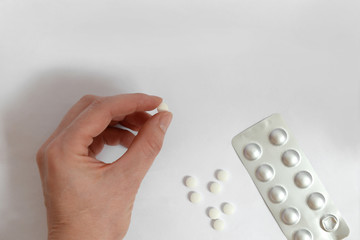 Tablets in the hand and on the table