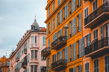 white and orange stucco buildings in a row