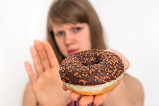 Woman Refuses To Eat Donut - Dieting Concept