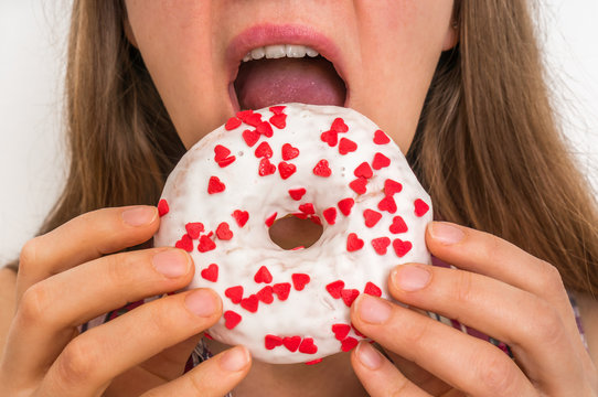 Woman is eating a delicious donut