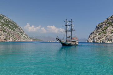 Obraz premium traditional Turkish ship (Gulet) in Porto Ceneviz bay on Mediterranean coast Antalya province, Turkey