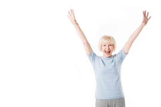 Senior Woman Standing With Arms Up Isolated On White