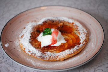 Apple pie on the plate with vanilla ice cream. Restaurant food. Traditional desert. Cooking at home.