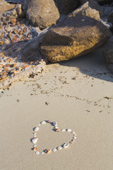 Fototapeta na wymiar Heart shaped from shells lies on a beach in the sand on Koh Samui