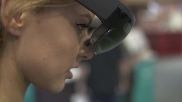 Future is now. Attractive young woman wear VR headset