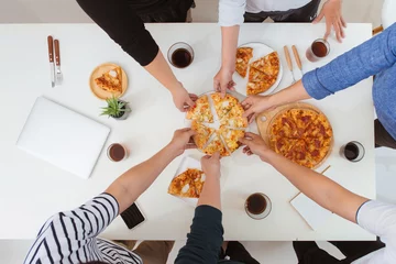  Lunch and people concept. Happy business team eating pizza in office © makistock