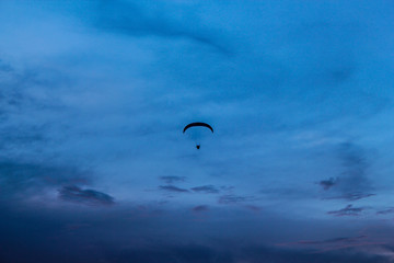 Parachute on the blue sky. This photograph was taken in São Carlos, São Paulo, Brazil, 2016.