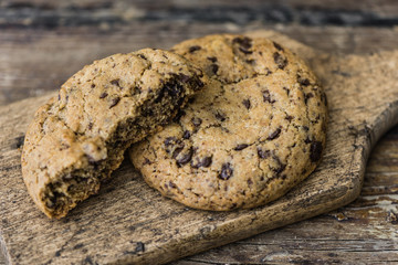 Freshly Baked Chocolate Cookies on a Cutting Board. Sweet Biscuits. Homemade pastry.