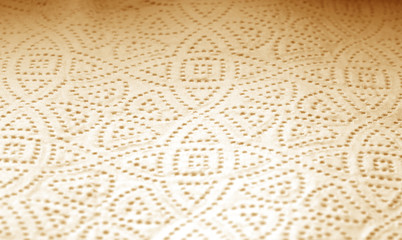Paper towel surface with blur effect in brown tone.