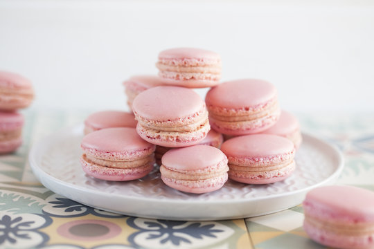 Close-Up of a stack of pink macaroons on a plate